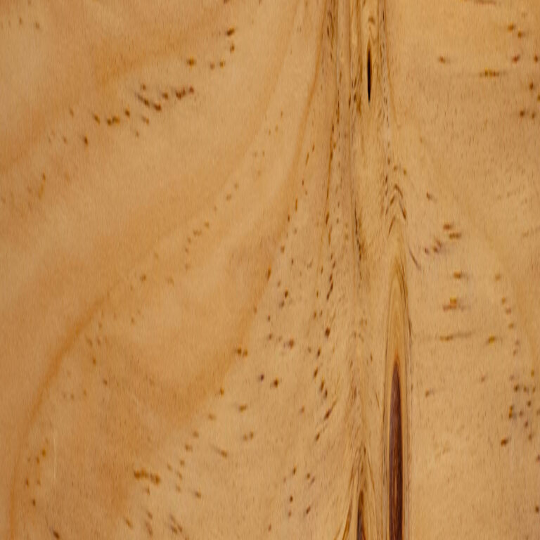 Close-up of a light brown wood surface showing smooth flowing grain, a vertical knot with darker streaks, and scattered small dark specks.