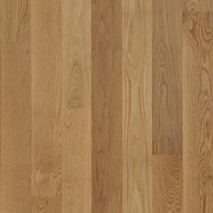 Warm-toned oak hardwood floor planks showing varied grain patterns, color tones, and natural knots